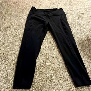 Black Gaiam high-waist leggings with pockets.